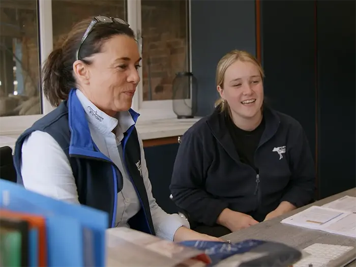Karen Halton training an employee at Halton Farms, Cheshire.