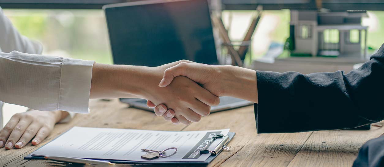 Shaking hands after successful interview. iStock.com/ArLawKa AungTun