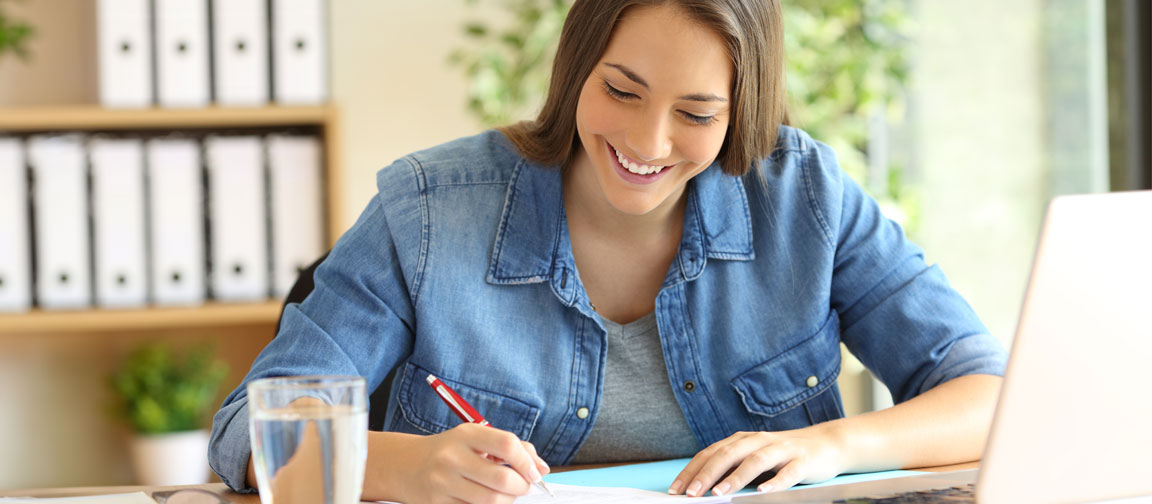 Woman looking over job advert paperwork. Picture: Antonio Guillem/Shutterstock.com